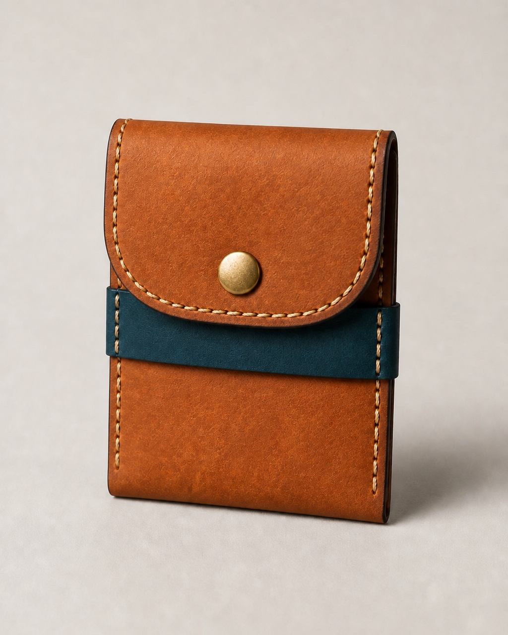 Snap pouch in cognac & teal leather